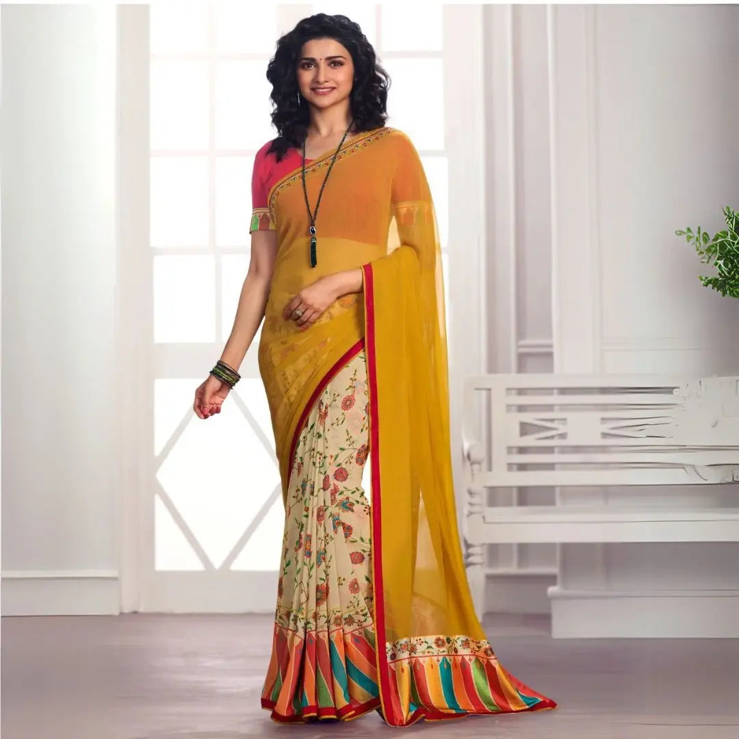 Woman wearing mustard yellow printed saree with floral design and multicolor striped border in a classic indoor setting