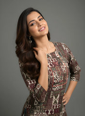 Woman wearing a patterned dress against a gray background