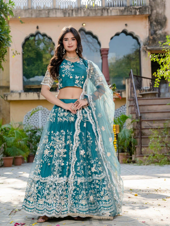 teal green sequins thread embroidered soft net lehenga