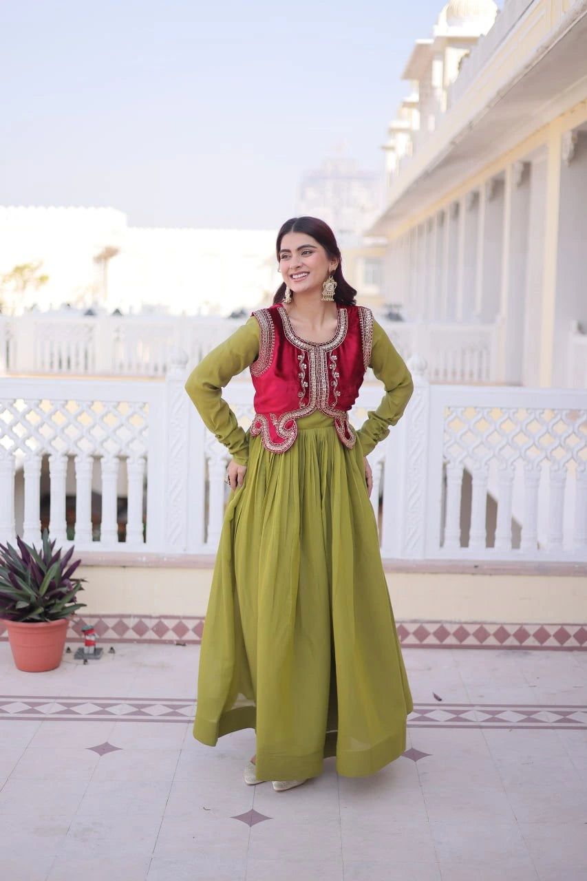 Woman in a green and red traditional outfit standing on a balcony with white railings and a clear sky.