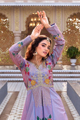 Woman in a traditional embroidered outfit posing in an ornate outdoor setting