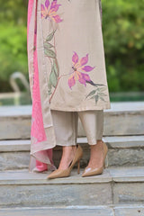Person wearing a floral outfit with high heels on stone steps