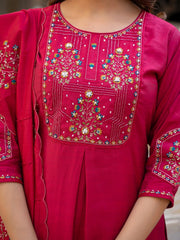 Close-up of a pink embroidered traditional outfit with floral patterns.