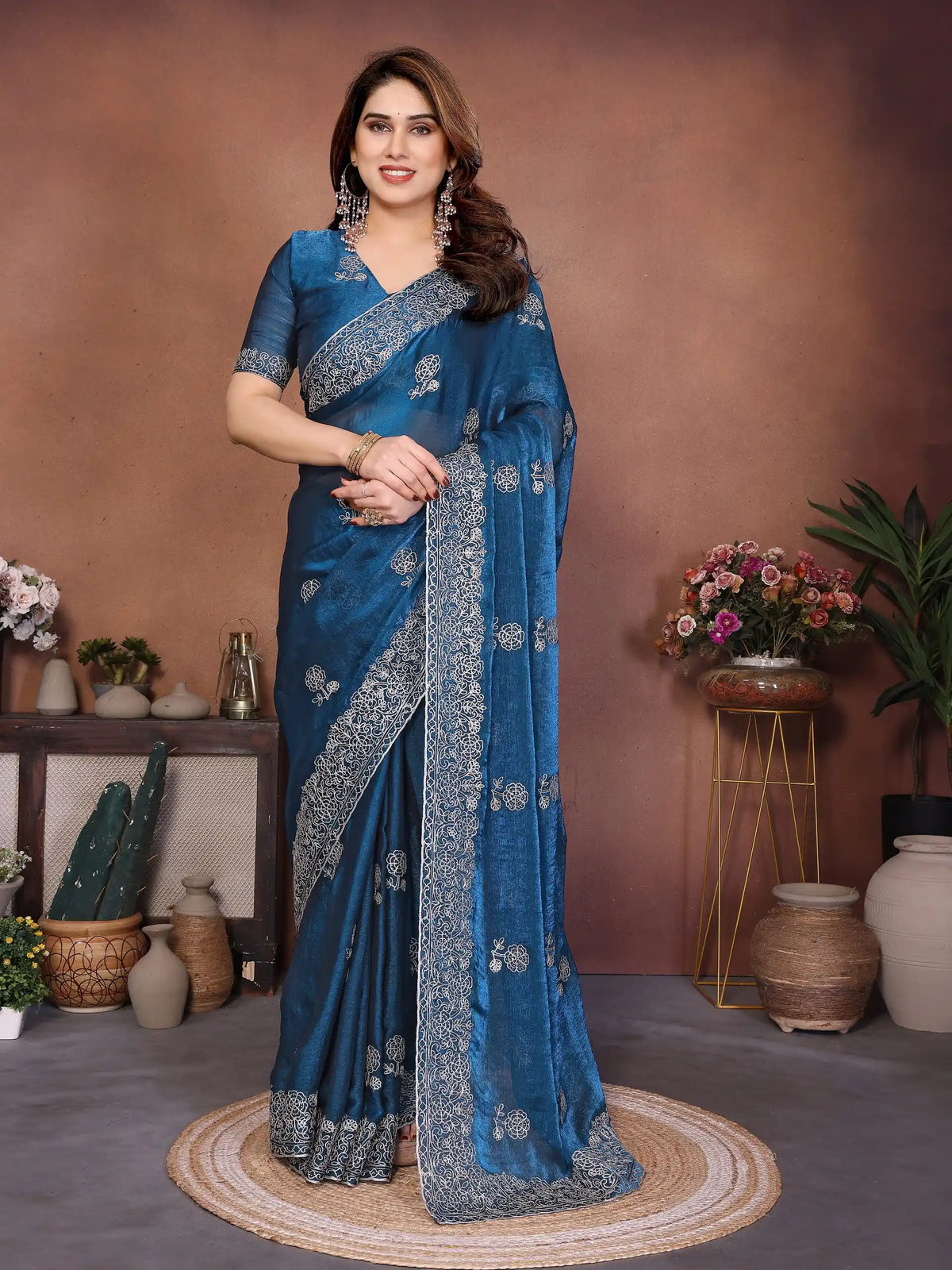 teal blue embroidered chiffon saree wirh zari work