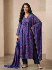 Woman wearing a blue patterned dress with a plain background