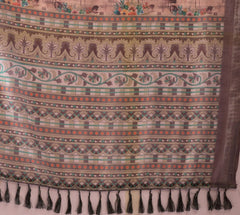 Patterned fabric with tassels on a plain background