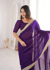 Woman wearing a purple saree with gold border in a bright room