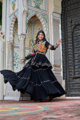 Woman in traditional outfit standing in front of an ornate architectural background