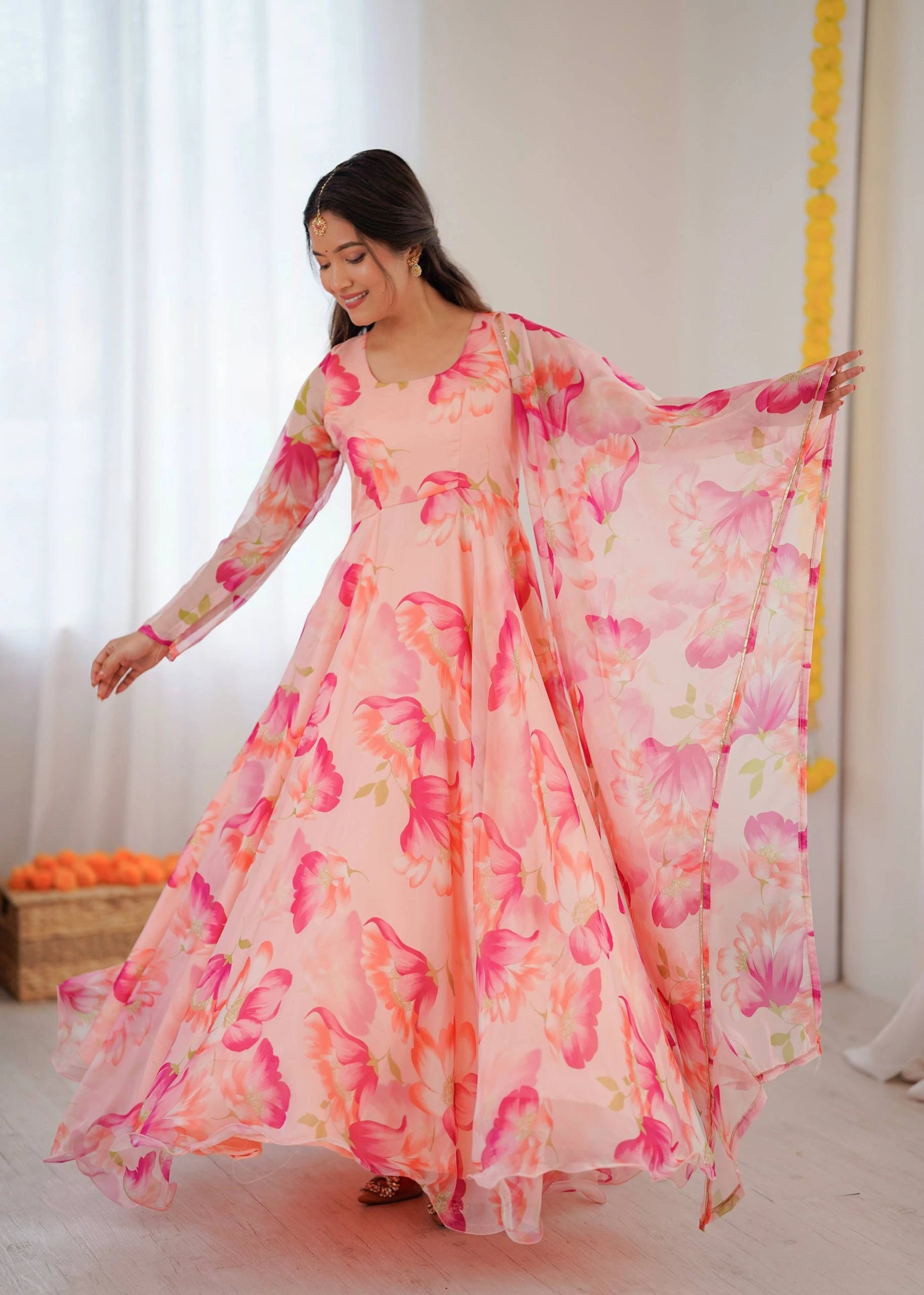 Woman wearing a floral dress with a white background