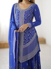 Blue embroidered traditional outfit with a white background