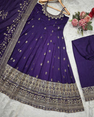 Purple embroidered dress with silver details on a white background