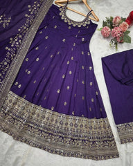 Purple embroidered dress with silver details on a white background