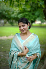 Powder blue fabric with intricate zari work design