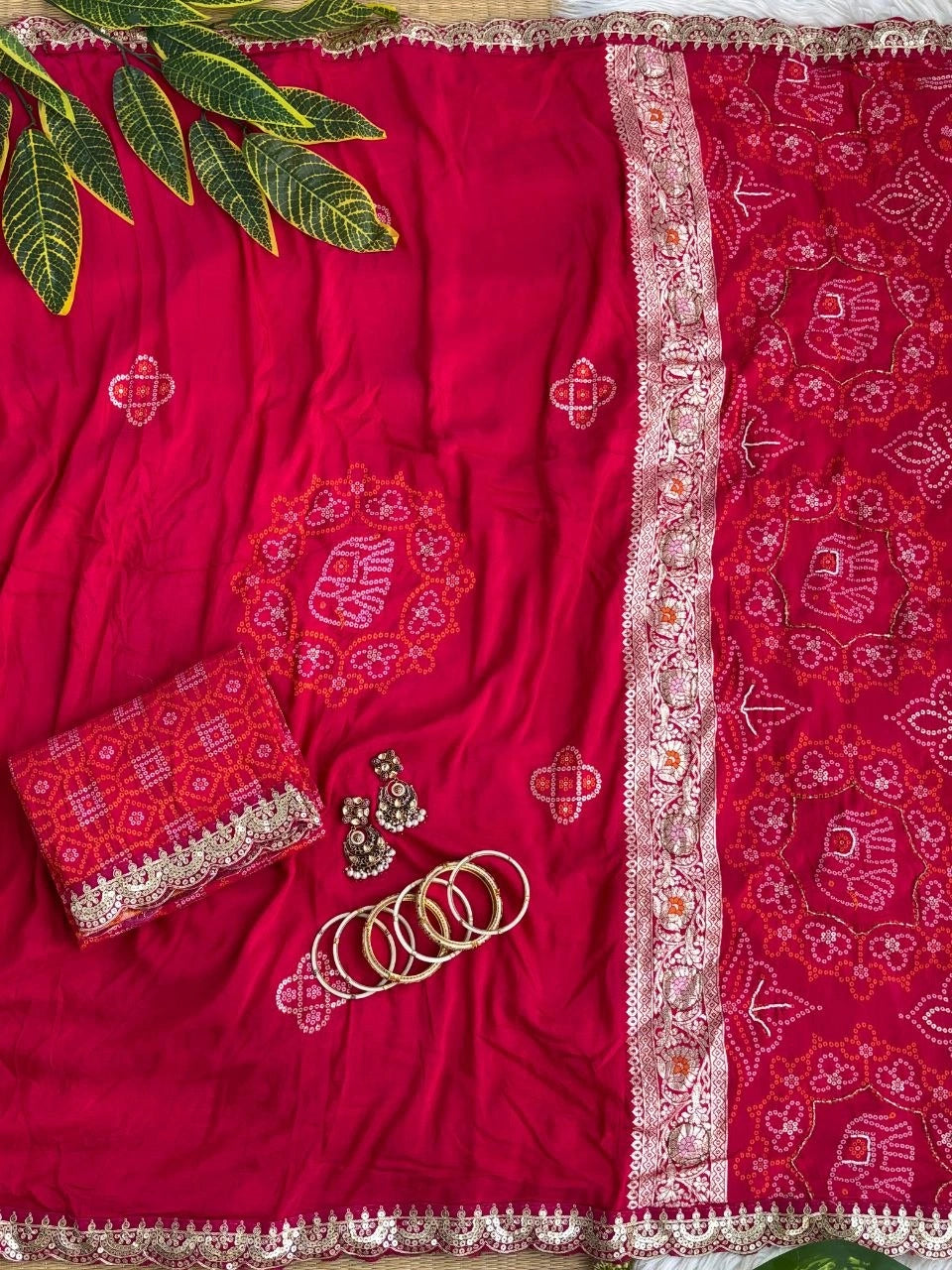 Rani viscose georgette saree with elephant bandhani motifs and lace border – Kalyanja KS408