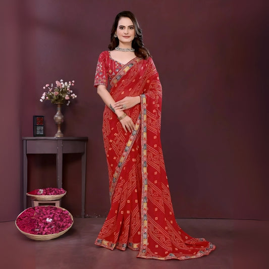 Woman wearing a red digital print saree with embroidery work and a contrast patterned border, paired with a matching blouse in an indoor studio product image, Indian ethnic wear