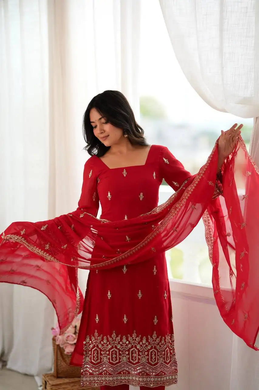 Red Beads Embroidered Suit Kalyanja KU254 model at window dupatta flowing