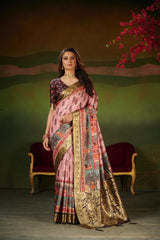 woman wearing soft pink jacquard work silk saree with intricate border and ethnic blouse in royal setting