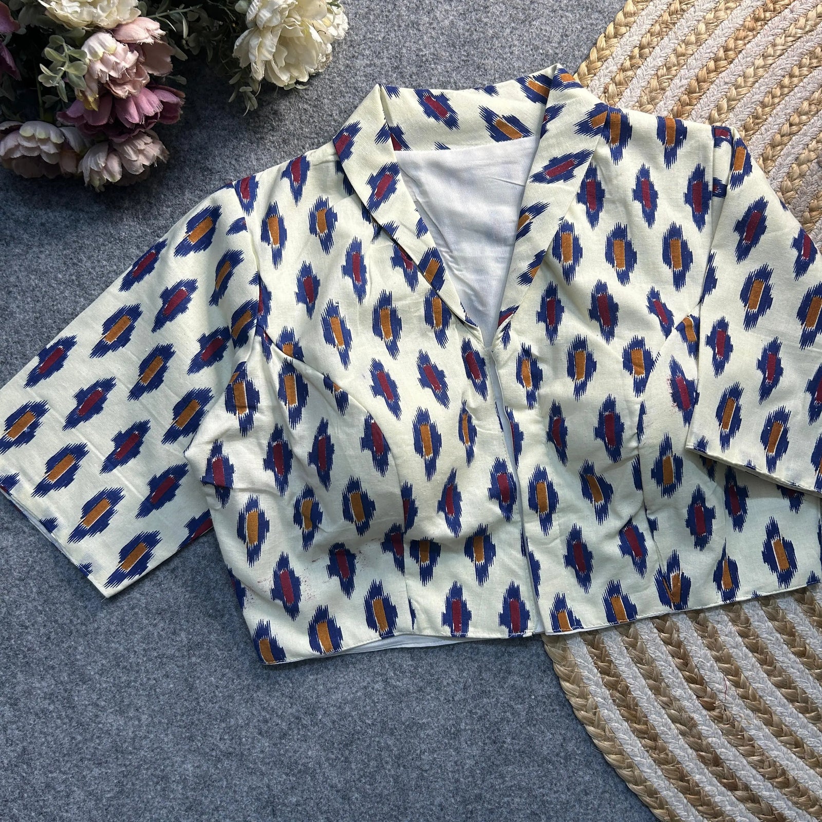 White Ajrakh print cotton blouse with a classic collar neck and elbow-length sleeves by Kalyanja.