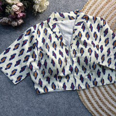 White Ajrakh print cotton blouse with a classic collar neck and elbow-length sleeves by Kalyanja.