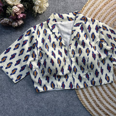 White Ajrakh print cotton blouse with a classic collar neck and elbow-length sleeves by Kalyanja.