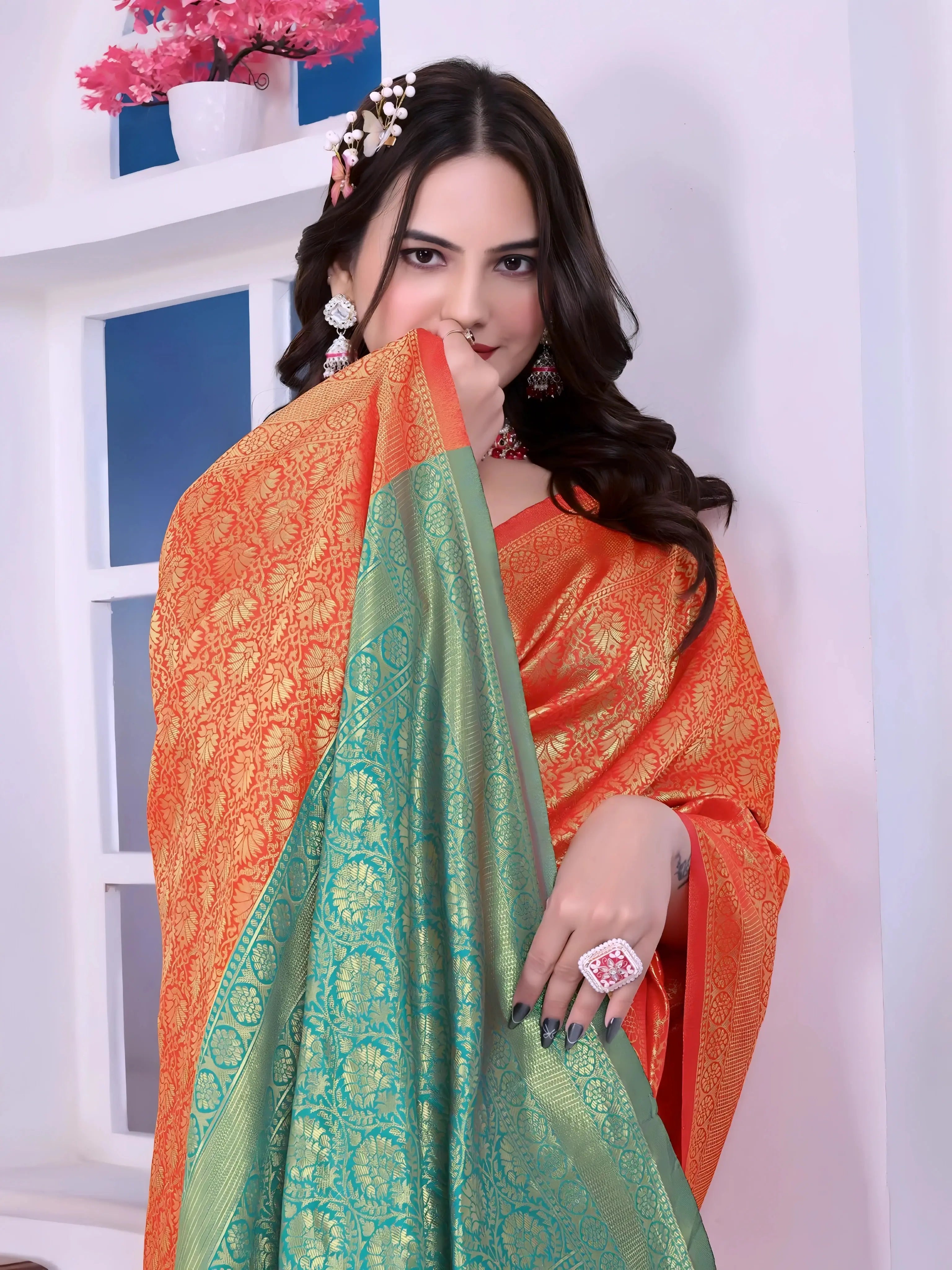 Woman Orange Silk Saree Green Pallu Golden Motifs Teal Blouse Indoor