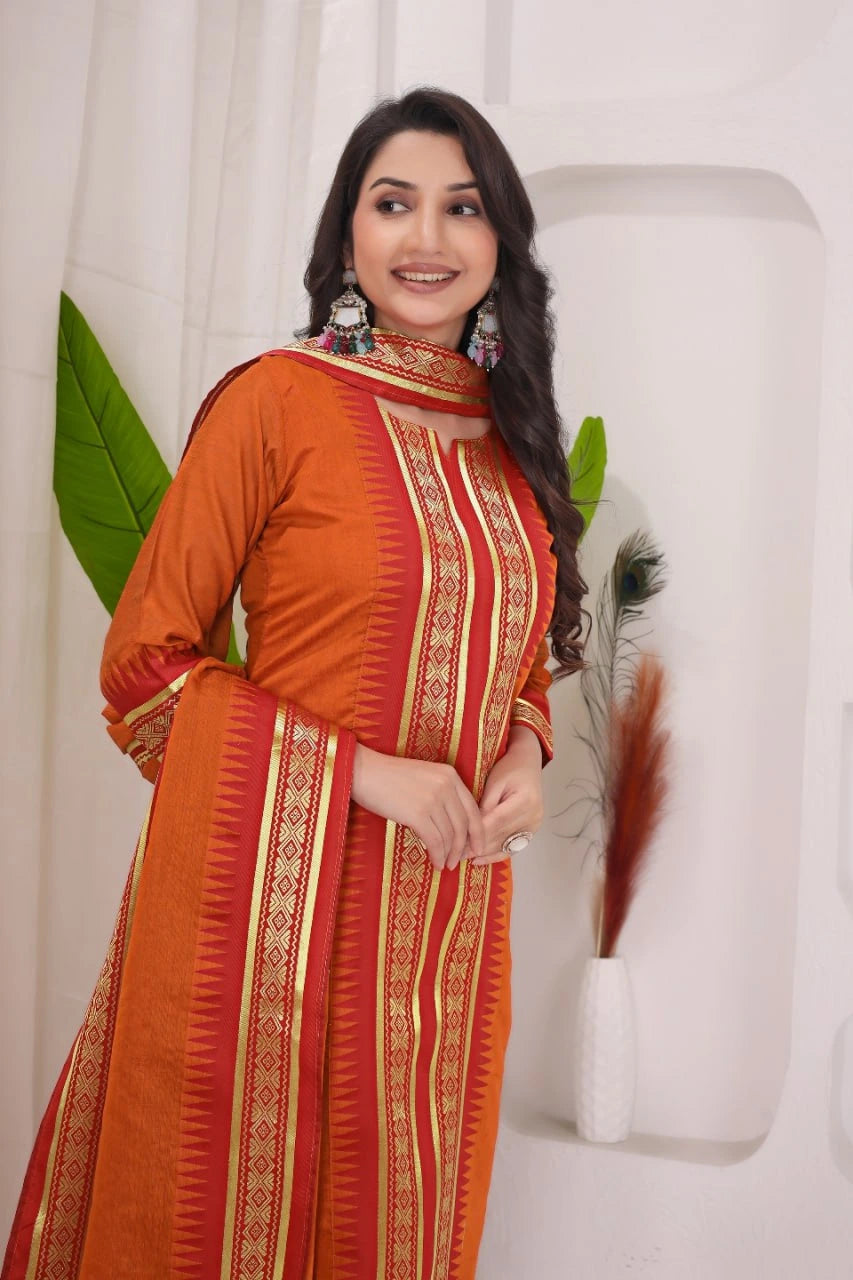 Woman wearing an orange and red traditional outfit with a white background