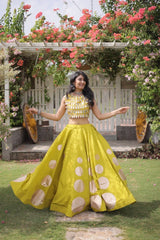 Stylish ethnic outfit combining a contemporary mirror work blouse with a graceful full-flare designer skirt.
