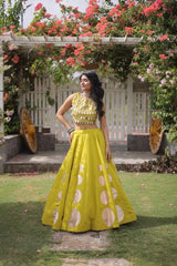 Premium yellow party wear lehenga designed with luxurious detailing and elegant traditional craftsmanship.
