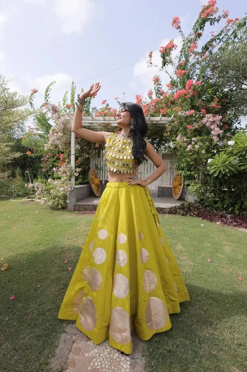Designer festive lehenga crafted with shimmering mirror embellishments and premium fabric for a vibrant ethnic look.