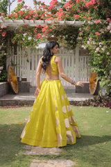 Luxurious full-length lehenga showcases premium quality fabric with striking oversized golden polka dot detailing.