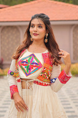 Woman in traditional outfit with colorful embroidery outdoors