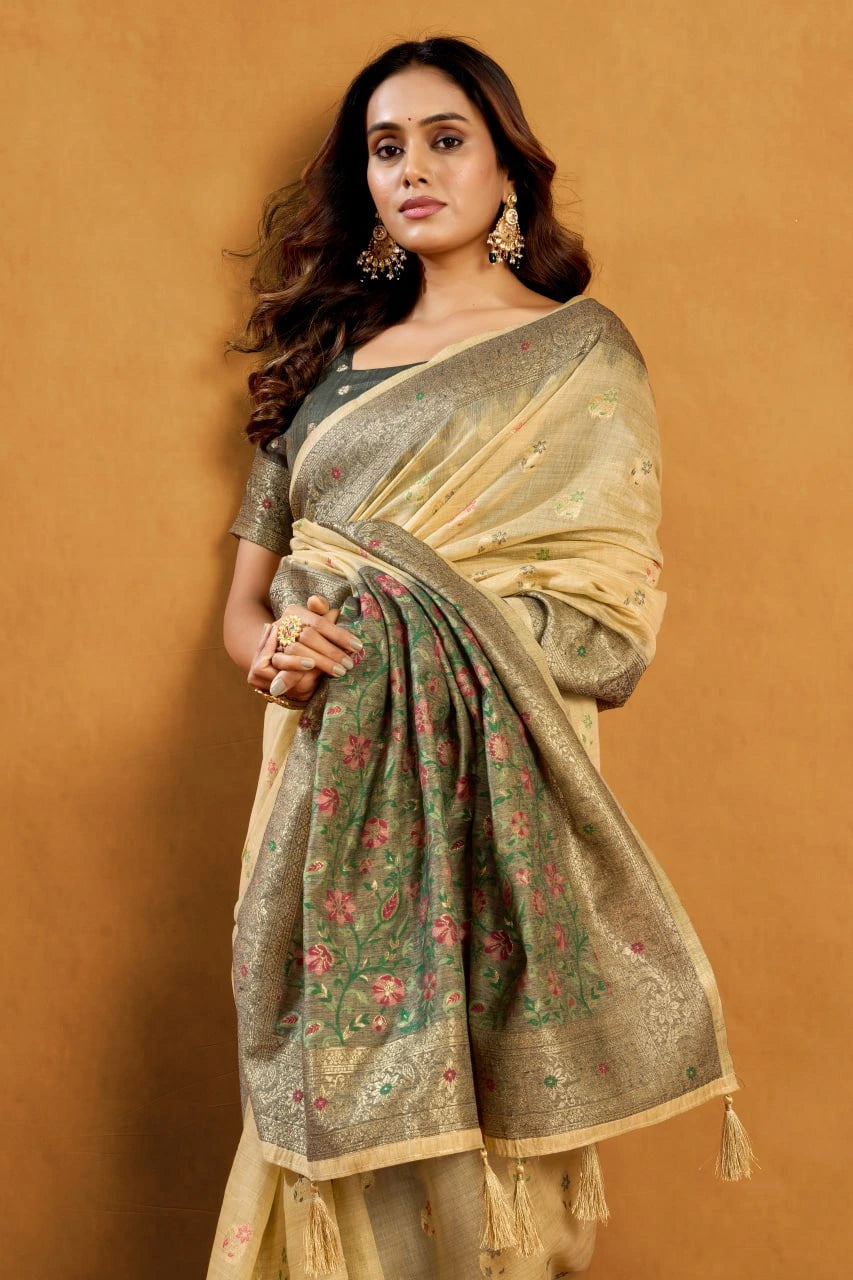 Woman wearing a traditional saree with a floral pattern on a beige background