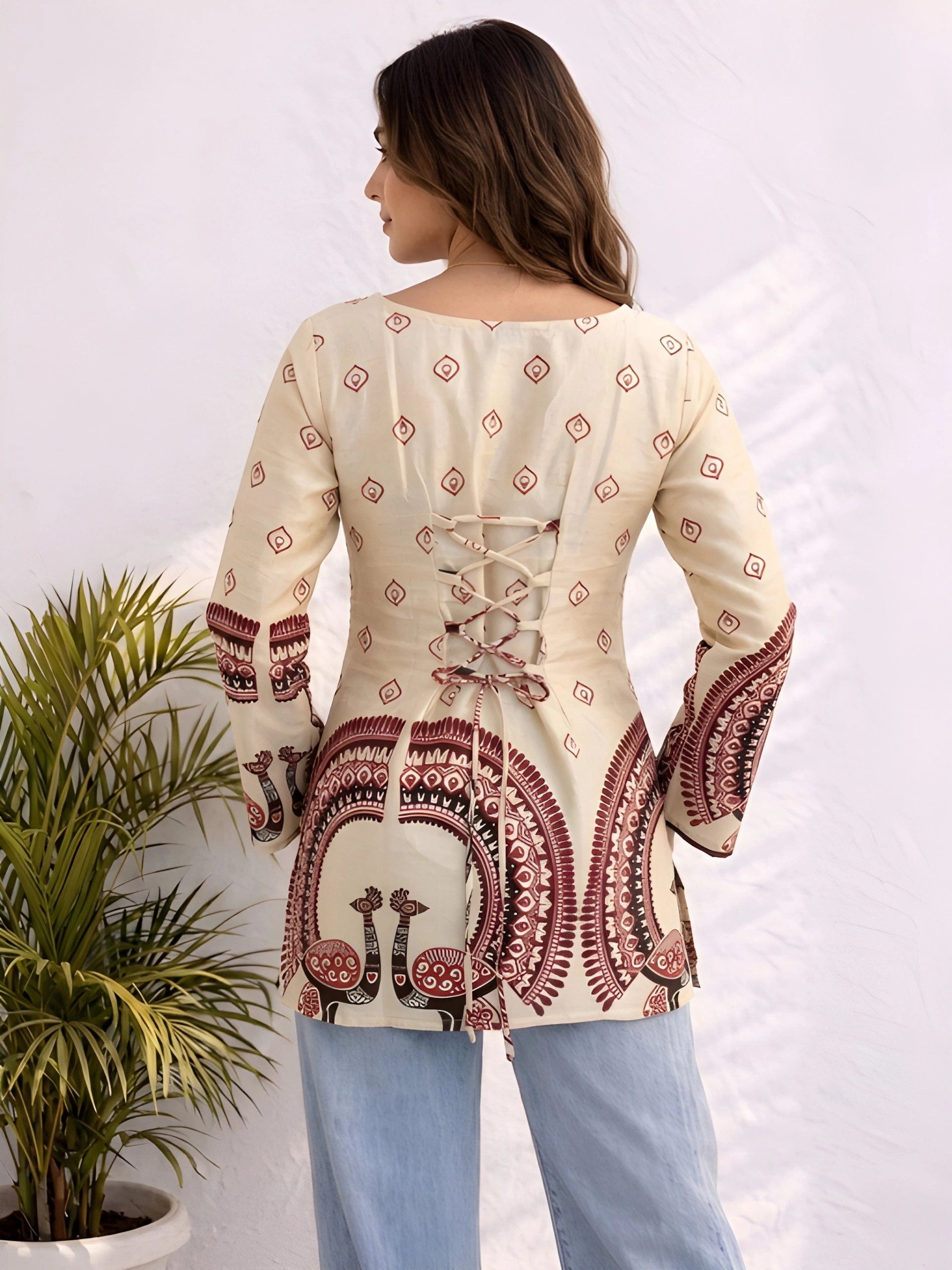 The top features maroon geometric and ornamental border patterns with a relaxed fit