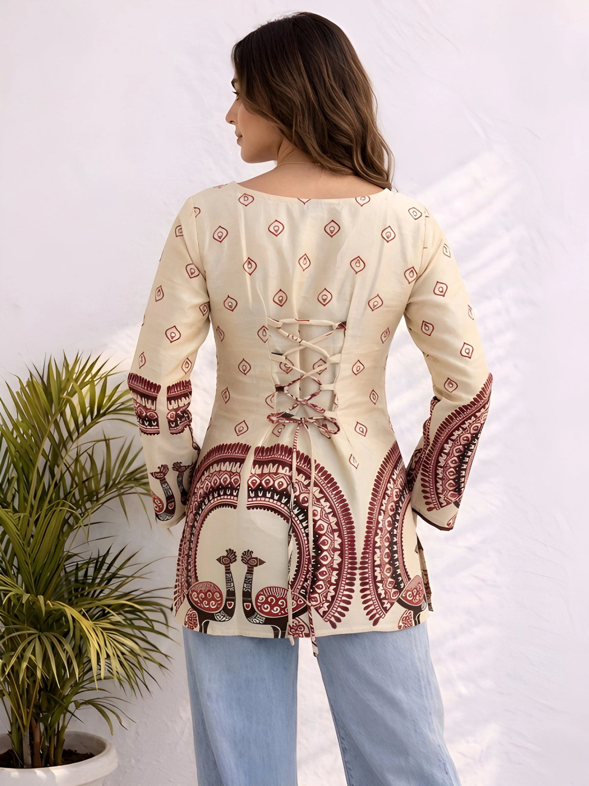 The top features maroon geometric and ornamental border patterns with a relaxed fit