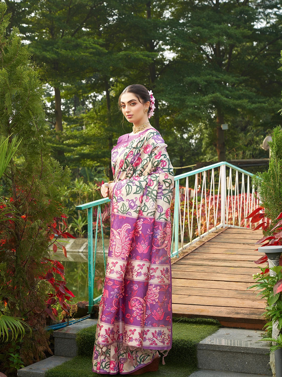 Graceful digital floral print saree in purple with intricate border design and stylish traditional look.