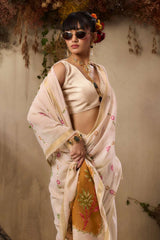 Her sleek updo with bangs and subtle makeup creates a refined contemporary look.
