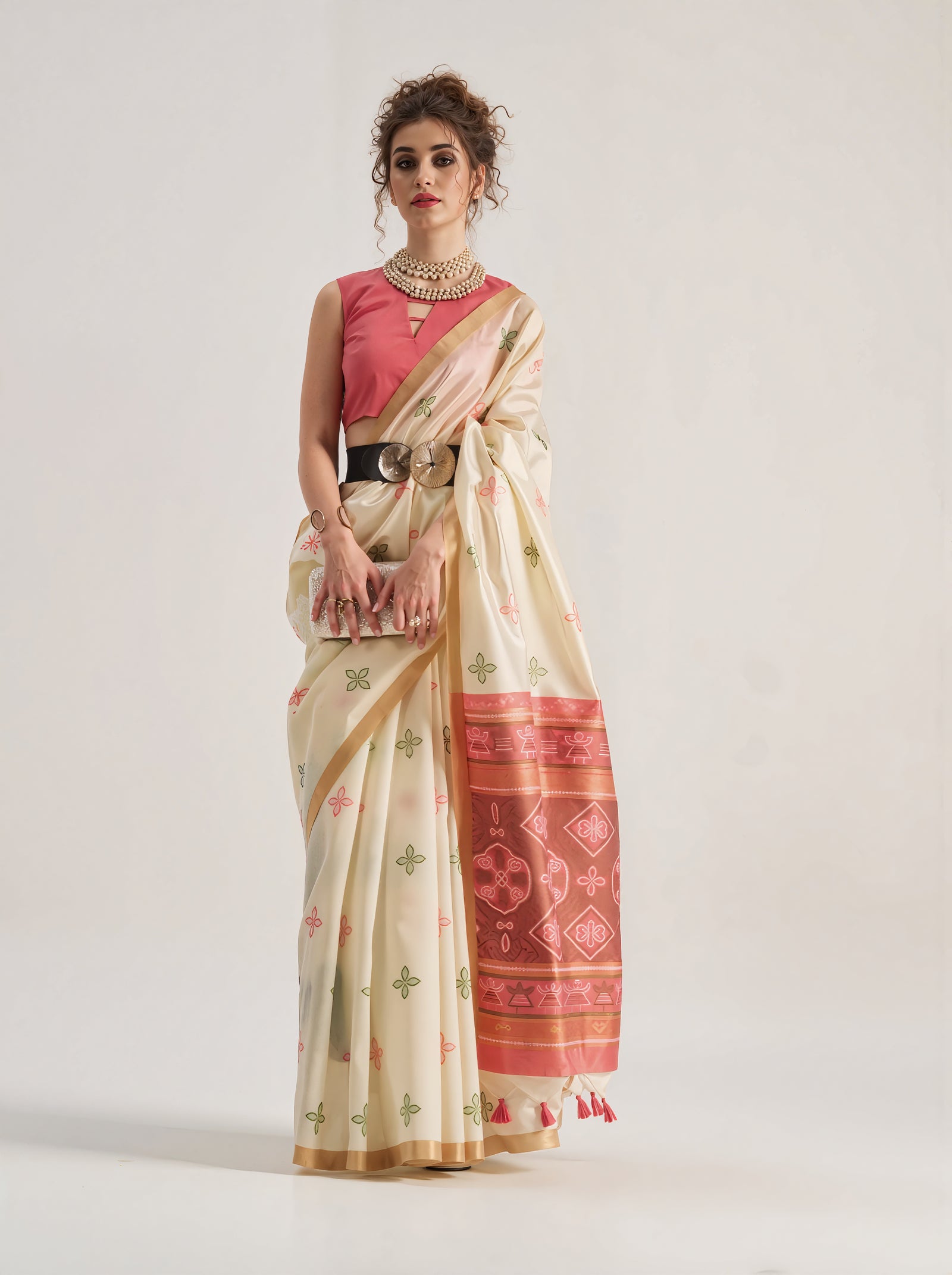 Elegant beige Patola silk saree featuring intricate geometric and floral weaving patterns. Includes a matching blouse piece. Ideal for festive and ceremonial occasions.