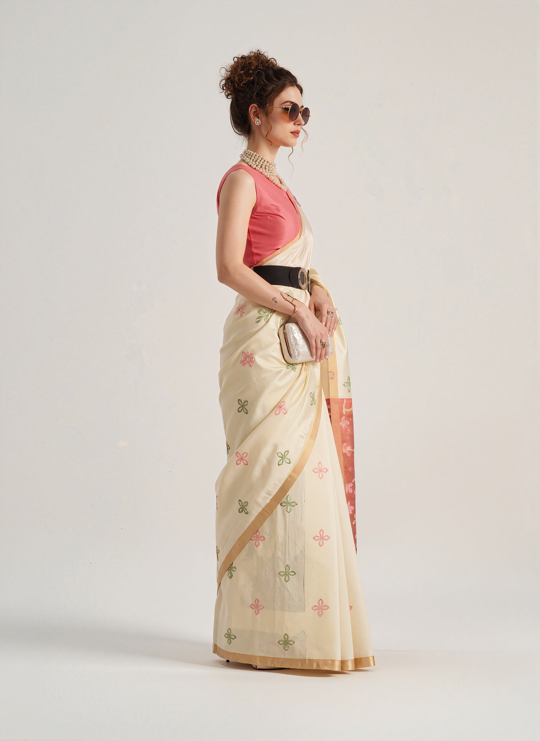 Beige Patola silk saree with intricate geometric and floral weaving patterns. Includes a matching blouse piece. Lightweight and elegant, ideal for festive and ceremonial occasions.