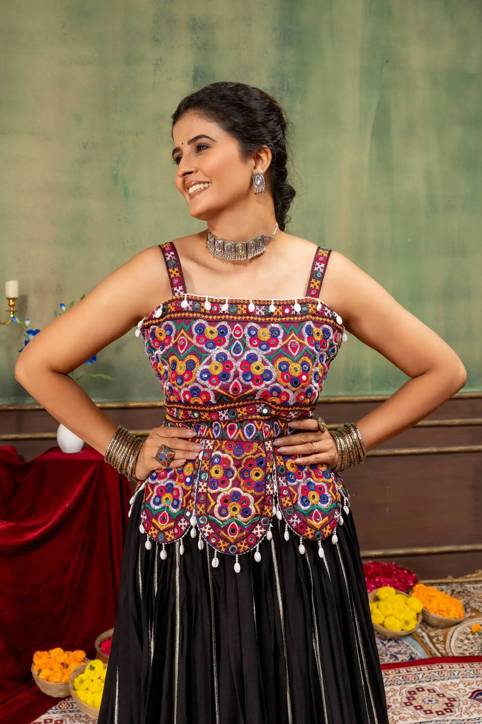 Close-up of Kutchi Rabari embroidered square neck choli with mirror work and cowrie drops