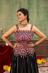 Close-up of Kutchi Rabari embroidered square neck choli with mirror work and cowrie drops