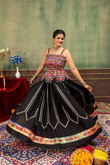 Black heavy embroidered Kutch work lehenga with multicolor choli, twirling front view