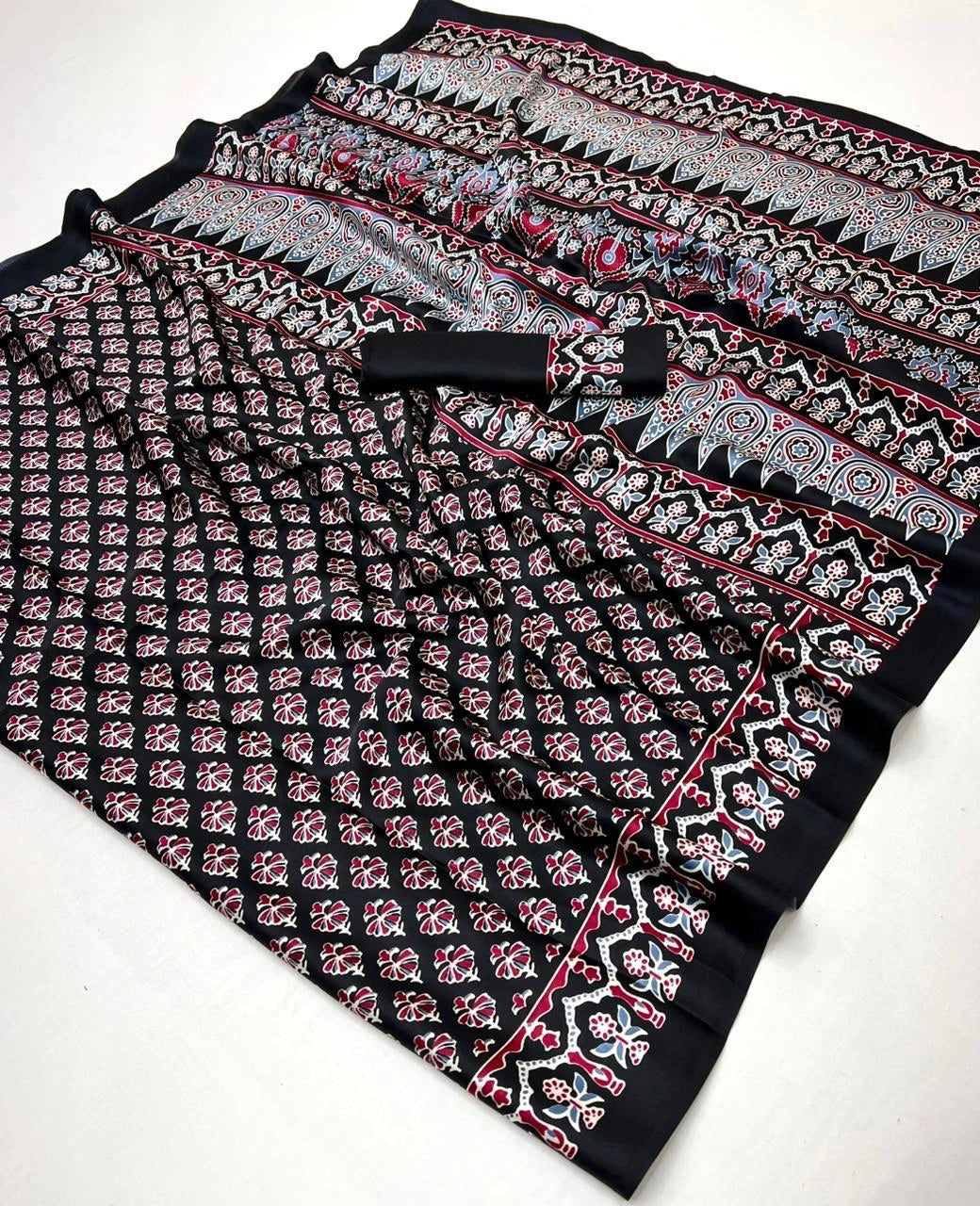 Folded fabric with intricate pattern on a white background