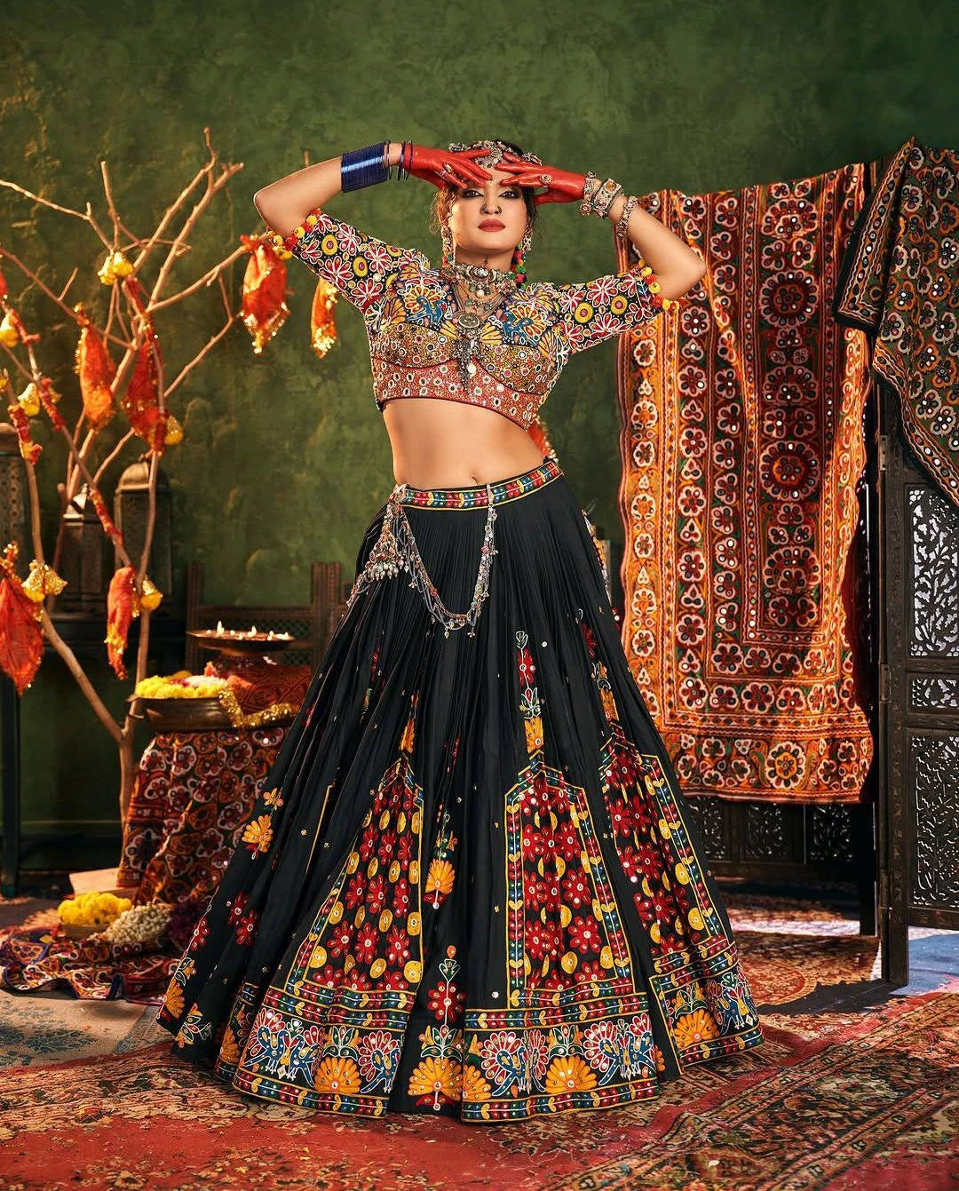 Woman in traditional embroidered outfit with a decorative background