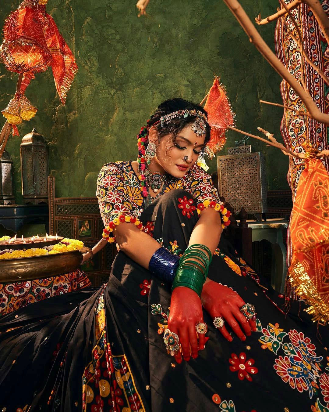 Traditional dancer in colorful attire with decorative elements in a festive setting