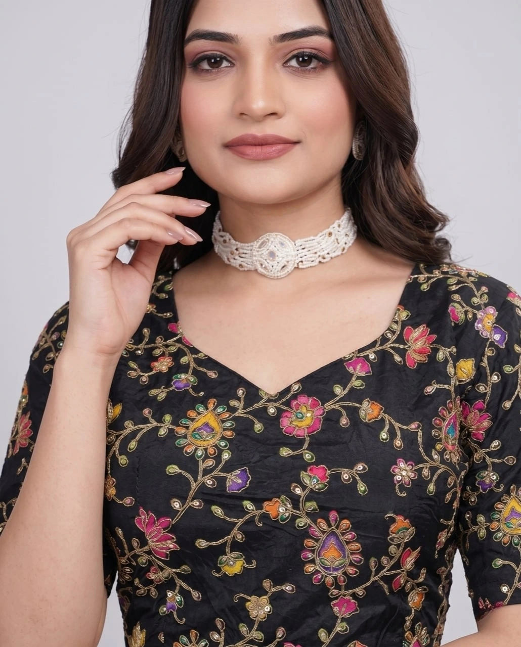 Stylish black pure viscose blouse featuring intricate embroidery and printed detailing.