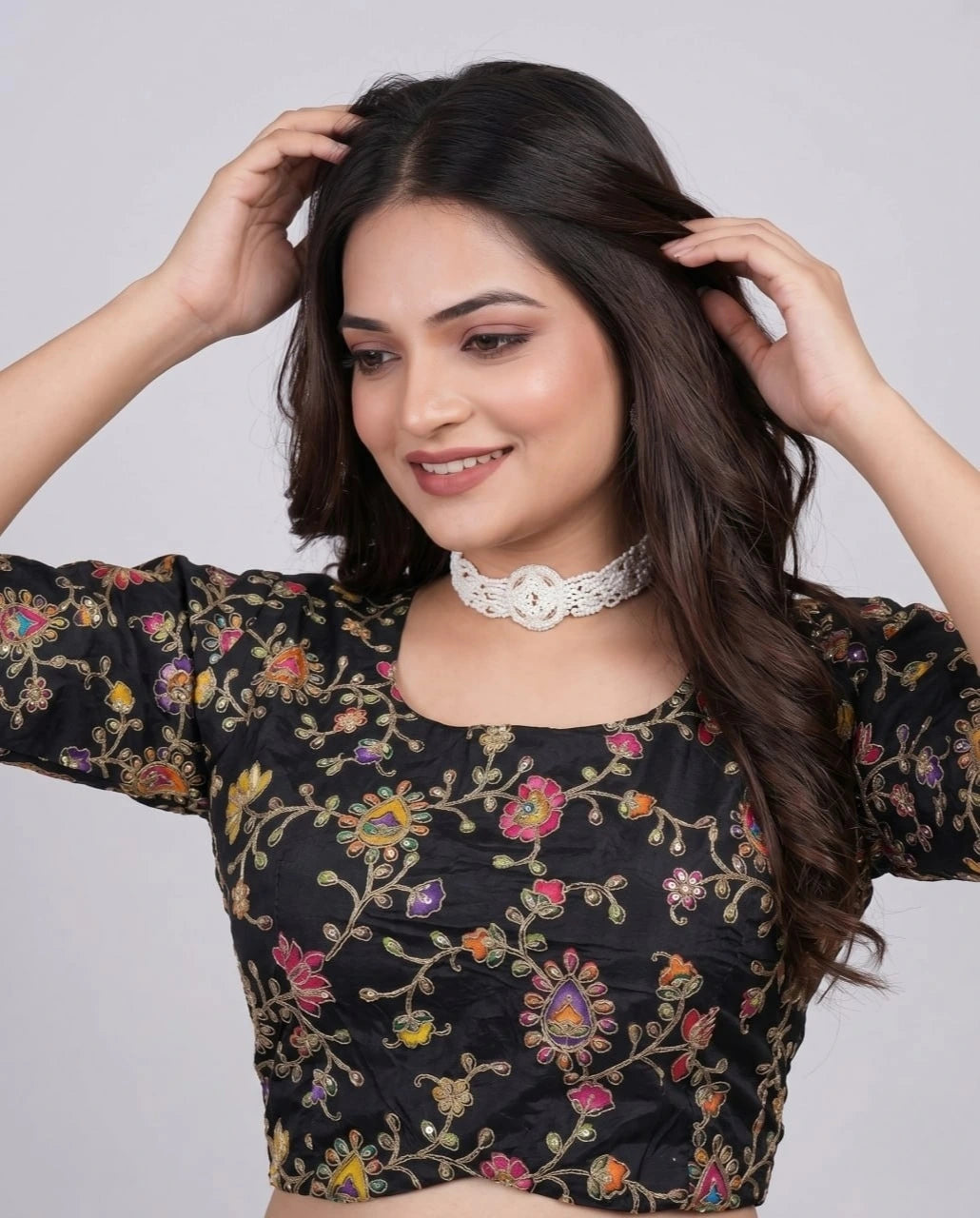 Traditional black embroidered viscose blouse with ornate printed accents.
