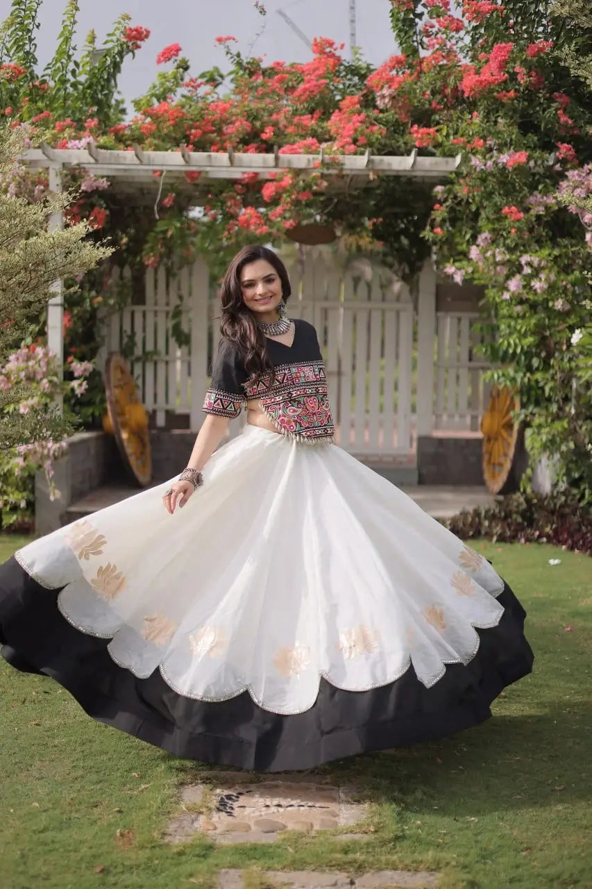 Elegant White Party Wear Lehenga featuring Designer Embroidered Blouse, Floral Motifs, and Broad Black Hem Border
