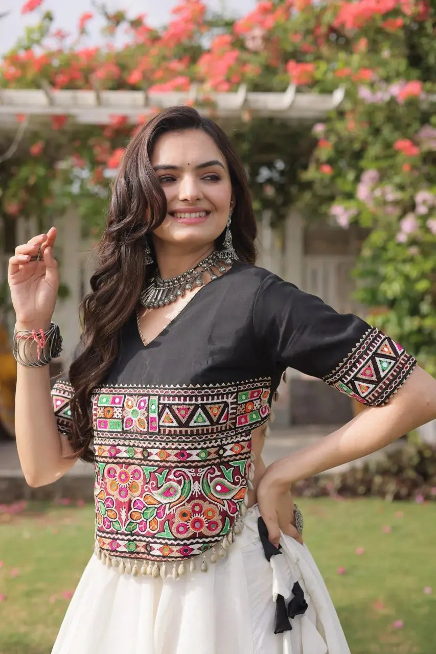 Elegant Black and Ivory White Lehenga Choli with Vibrant Embroidered Bodice, Flared Skirt, and Traditional Festive Appeal