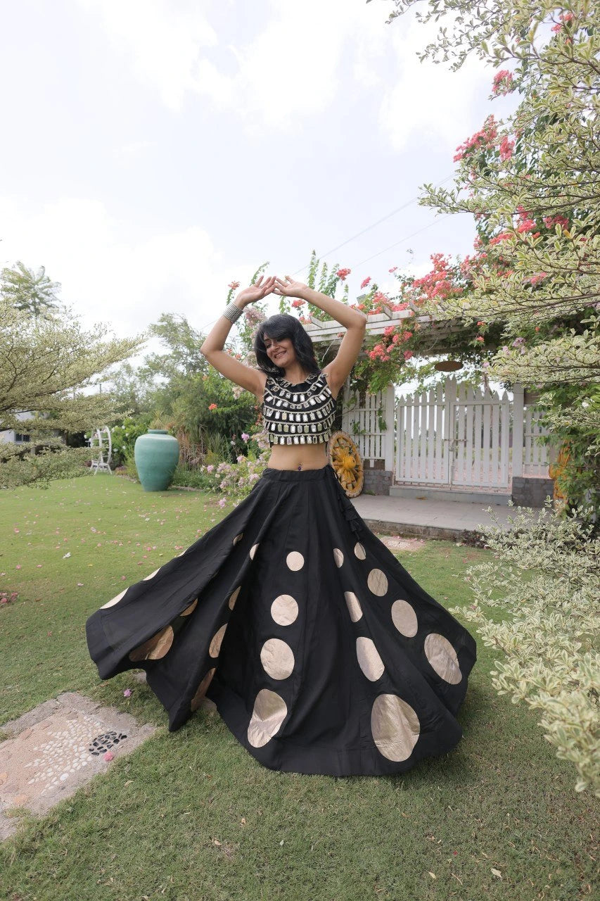 Gorgeous black designer lehenga with shimmering embellishments and golden accents delivers timeless festive elegance.
