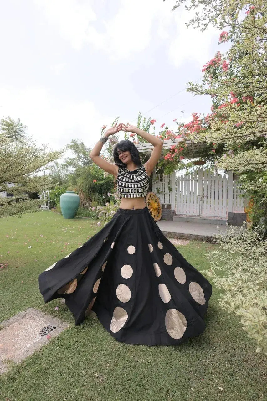 Gorgeous black designer lehenga with shimmering embellishments and golden accents delivers timeless festive elegance.